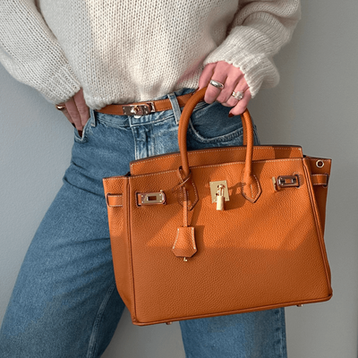 Brana – Elegant Handbag with Intricate Stitching and Unique Lock Closure