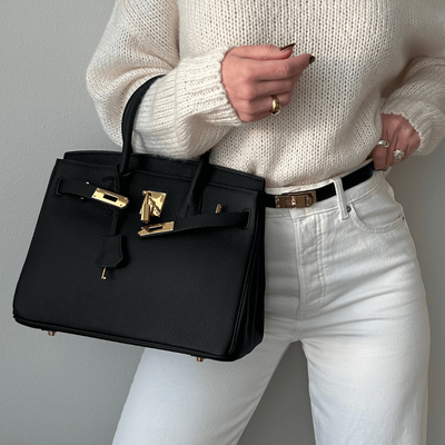 Brana – Elegant Handbag with Intricate Stitching and Unique Lock Closure