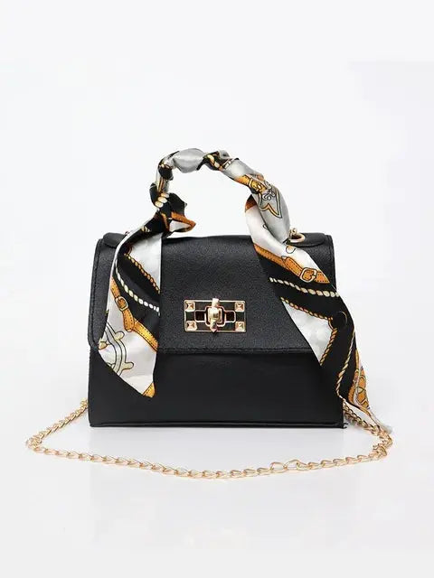 Brown Leather Handbag with Gold Accents and Silk Scarf – Chic and Timeless Accessory