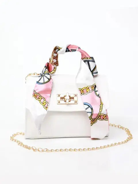 Brown Leather Handbag with Gold Accents and Silk Scarf – Chic and Timeless Accessory