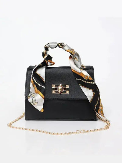 Brown Leather Handbag with Gold Accents and Silk Scarf – Chic and Timeless Accessory