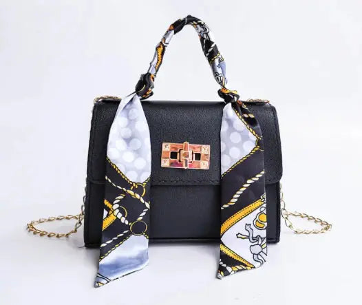 Brown Leather Handbag with Gold Accents and Silk Scarf – Chic and Timeless Accessory