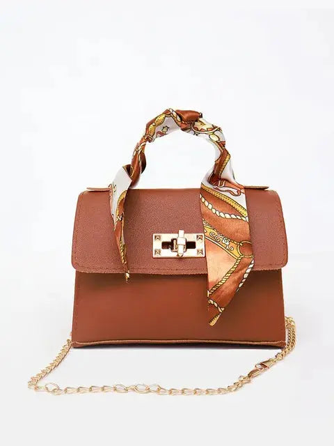 Brown Leather Handbag with Gold Accents and Silk Scarf – Chic and Timeless Accessory