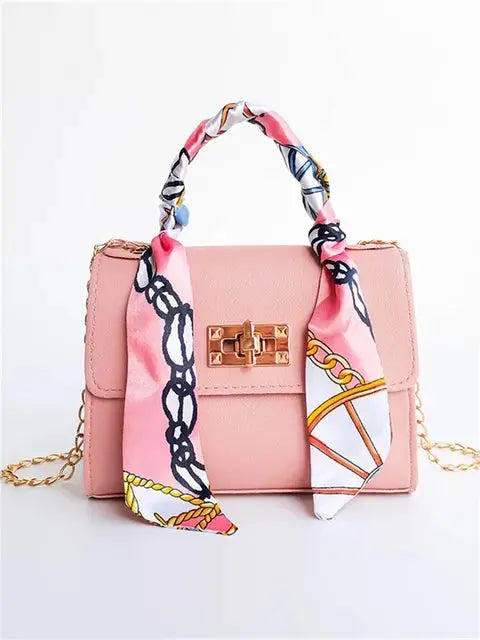 Brown Leather Handbag with Gold Accents and Silk Scarf – Chic and Timeless Accessory