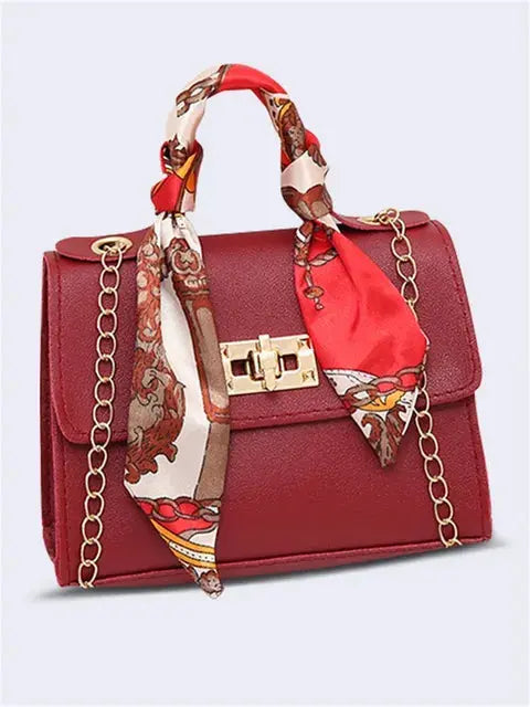 Brown Leather Handbag with Gold Accents and Silk Scarf – Chic and Timeless Accessory